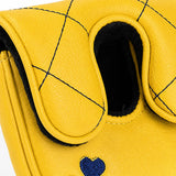 Close-up detail of the yellow quilted diamond stitching and shearling-lined cuff opening on the mallet putter headcover. Studio product photo on white background - HeadCaddy